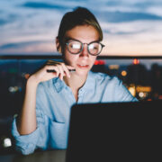 Woman working remotely on a laptop.
