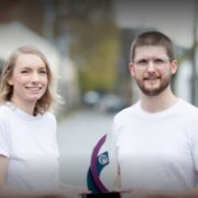 man and woman in white t-shirts.