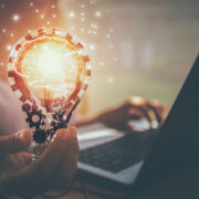 hand holding an idea light bulb.