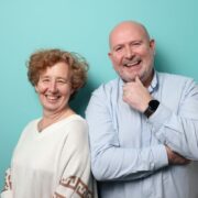 Smiling man and woman.