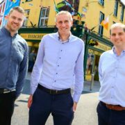 Three men on a street in Galway.