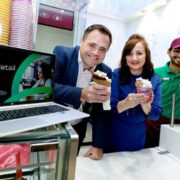 Two people holding icecreams.