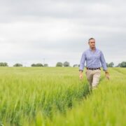 Man walking through a field.