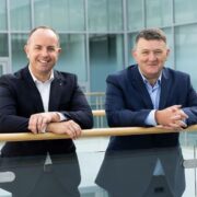 Two men in dark suits.