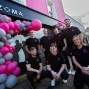 group of people outside a building.