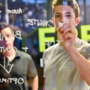 Business team working out SEO strategy by writing on a window.