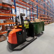 Woman driving a forklift at an IKEA distribution centre in Dublin, Ireland.