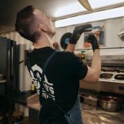 Pizza chef throwing dough in the air.