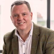 Man in brown blazer.