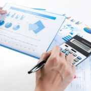 accountant at work using a calculator.