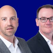 Two men in business suits.