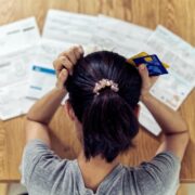 Woman stressing over bills.