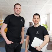 Two men in black t-shirts.