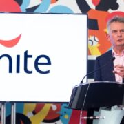 Man speaking at podium.