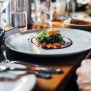 Person eating food in a restaurant.