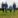 Farming family walking across a field.