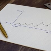 sketching out the financial future of a business on a piece of paper.