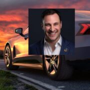 Man inset on image of Audi electric vehicle.