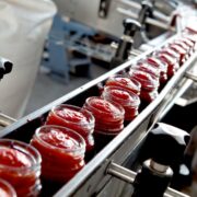 Jars of food on an assembly line.