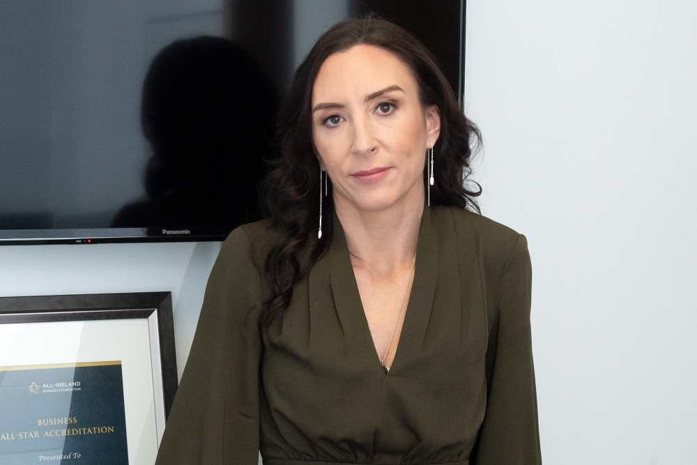 Woman in green suit.