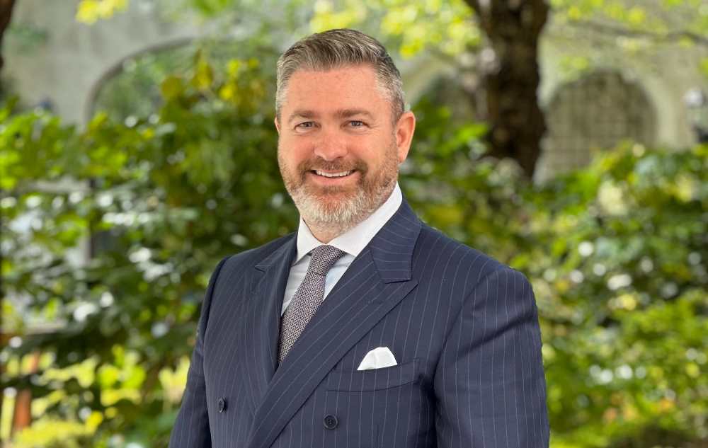 Bearded man in suit.