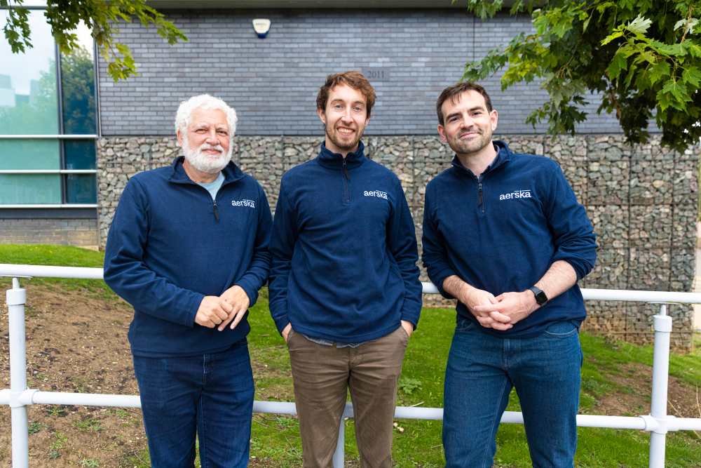 Three men in navy tops.