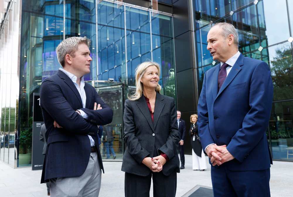 Two men and a woman outside a building in Dublin.