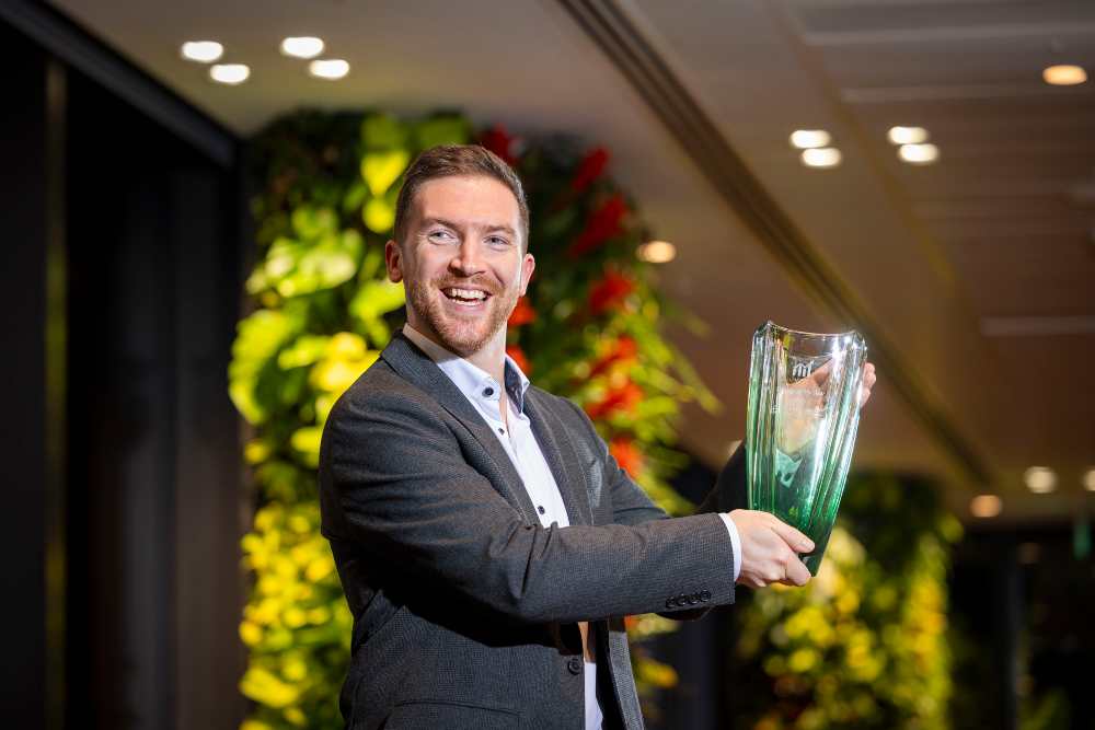 Man holding an award.